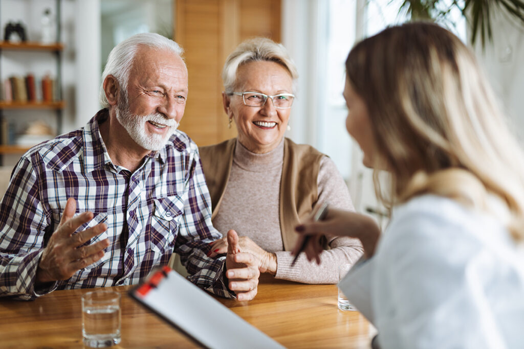 people smiling while learning about questions to ask when looking for assisted living