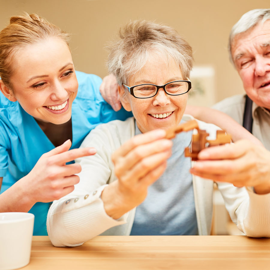 a senior woman gets support with improving her hand dexterity