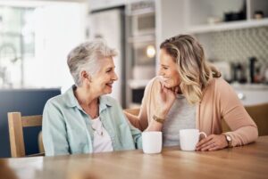 a woman assumes a caregiving role for her aging mother