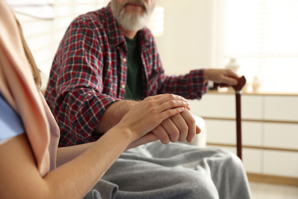 person balancing work and caregiving