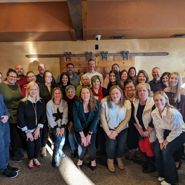 Residents and staff celebrating together at a holiday party